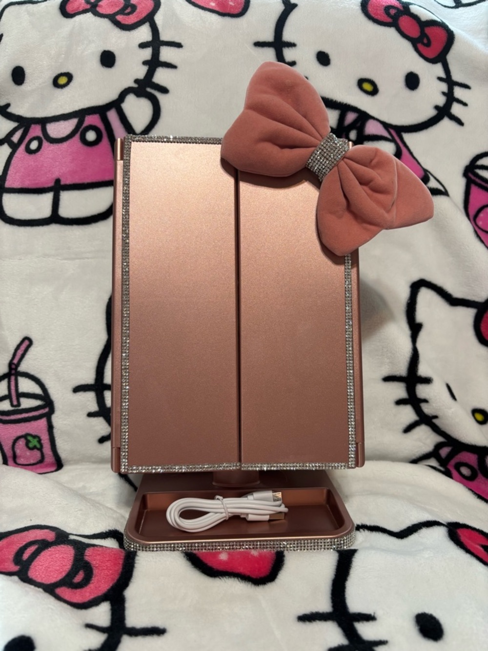 Pink trifold makeup mirror with lights